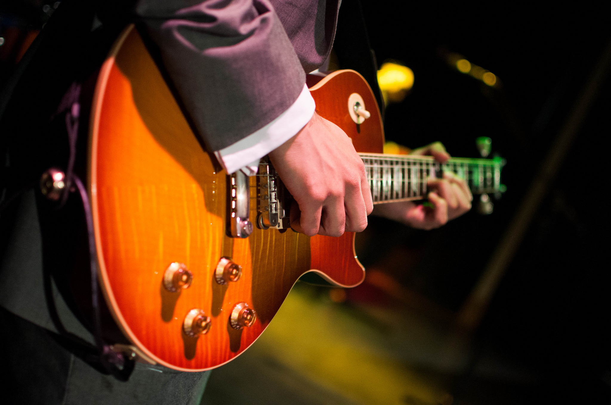 Close up of electric guitar performance at live event